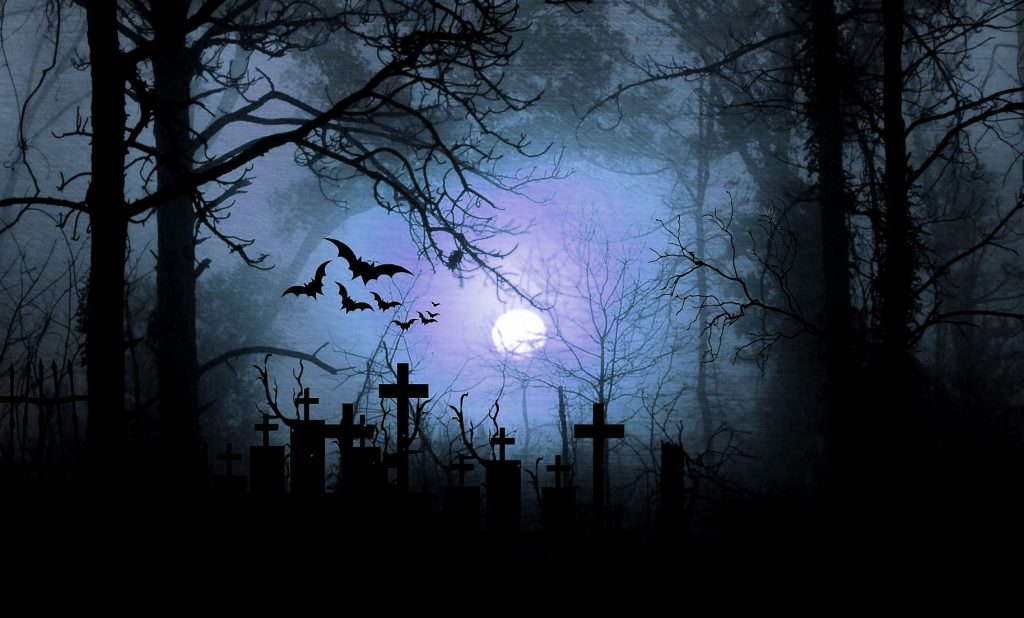 Moonlit graveyard by night